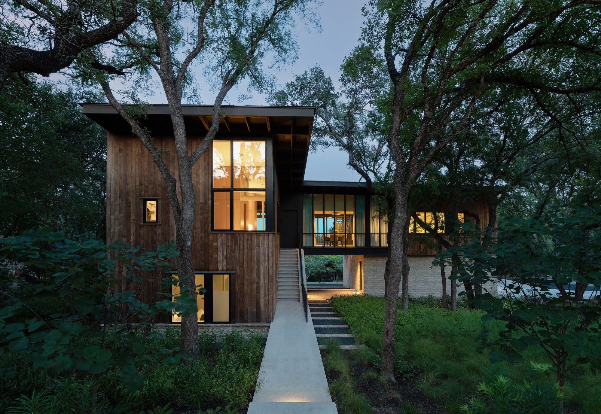 Modern Austin house with wood cladding and dormer entry