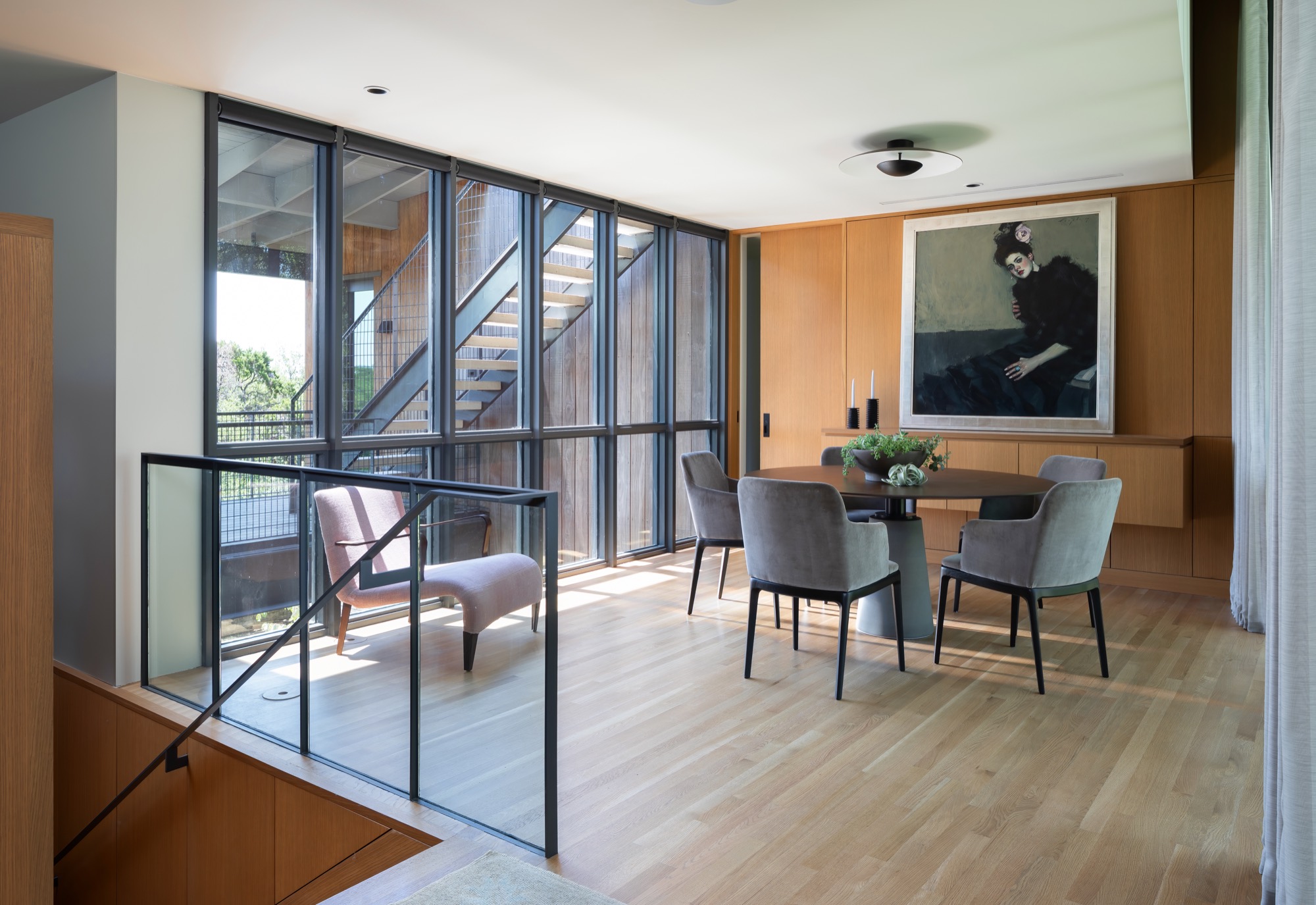 View from the bridge toward the dining room of a modern Austin house