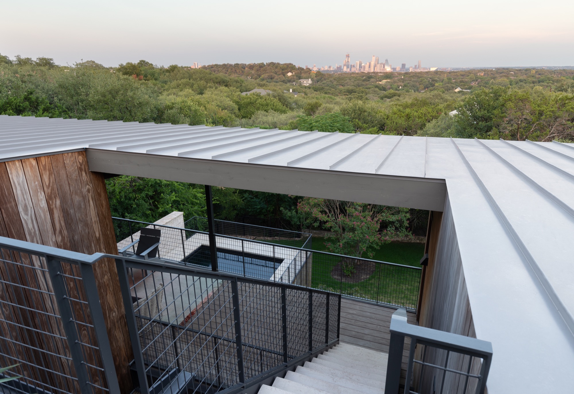 Roof stair of a modern Austin house with a skyline view